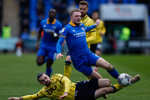 Carl Winchester of Shrewsbury Town and Ciaron Brown of Oxford United (AMA)