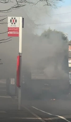 The bus was seen completely covered in smoke as firefighters worked tackled the blaze
