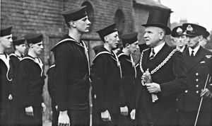 Day of remembrance for the Royal Navy and the Merchant Navy, Darlington Street Methodist Church, Wolverhampton, July 20, 1942. The photograph shows the Mayor of Wolverhampton, Councillor G. Bates, inspecting the Wolverhampton unit of the Sea Cadet Corps, with Lieutenant H. C. Wilson on the right.
