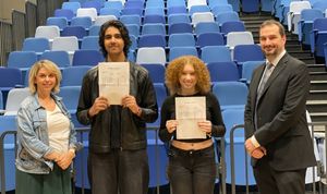Executive Principal, George Faux, and Associate Principal, Mary Henderson celebrate with students who are receiving their GCSE results.