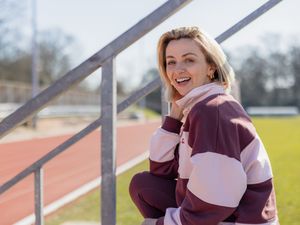 Lisa McGrillis sat in a stand overlooking Tooting Bec track in south London