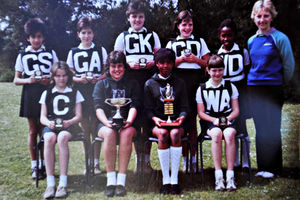 One of her earlier awards – Beverley holding a netball trophy
