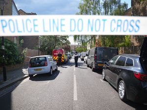 A police cordon is seen in Kentish Town, north London