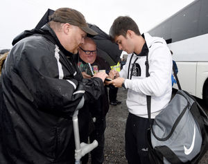 Hollyoaks star Ollie Morgan signs an autograph