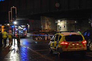 Police and fire crews at the scene after a lorry got stuck under the bridge near Shrewsbury's railway station. Picture: Jonathon Smith.