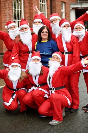 Val Edwards, centre, with her Santa colleagues 