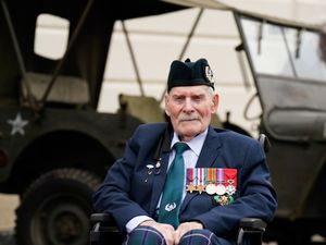 Donald Turrell in a wheelchair wearing medals