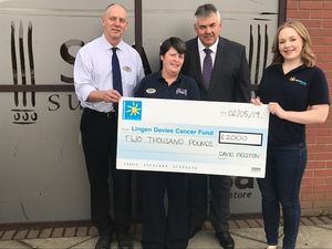Supporting image for story: Clerk helps Shropshire cancer charity get £2,000