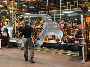 Workers at a car factory