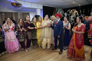 UK's 1st gidha competition winners were Addi Tappa from Derby, with Councillor Amrik Jhowar during the trophy presentation
