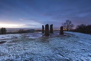 Winter sunrise over the Four Stones at Clent Hills, Worcestershire.