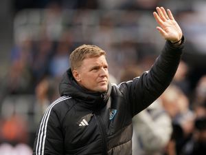 Newcastle manager Eddie Howe waves to the fans upon his return to the touchline against Ipswich
