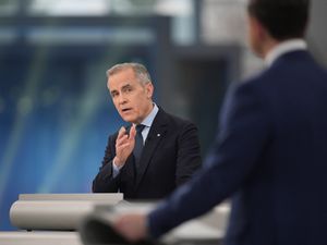Liberal leader Mark Carney makes a point towards Conservative rival Pierre Poilievre during the debate in Montreal