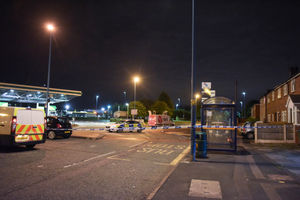 Police tape surrounds the scene