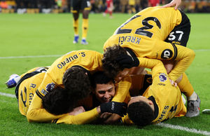 Wolves players celebrate Andre's winner (Photo by David Rogers/Getty Images)