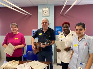 Multi-faith Chaplain, Kevin Place (centre) with the Ward 37 team.