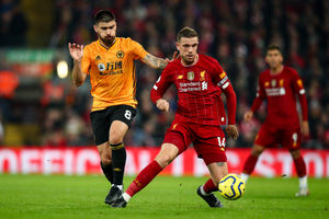 Ruben Neves of Wolves and Jordan Henderson of Liverpool (AMA)