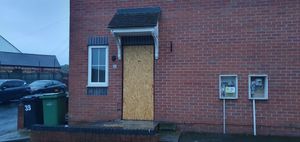 The front door was boarded up