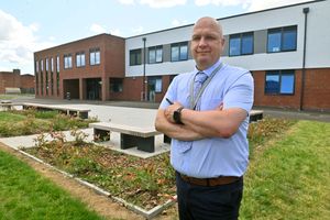 Headteacher at Shrewsbury Academy, Jim Taylor in front of the school's new STEM building
