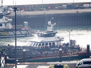 A group of people thought to be migrants are brought in to Dover, Kent, from a Border Force vessel following a small-boat incident in the Channel