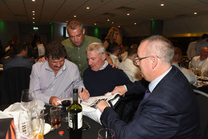 Former Wolves players Jackie Gallagher, Andy Thompson and Robbie Dennison signing shirts