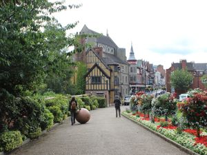 Supporting image for story: Artist rolls globe though home town