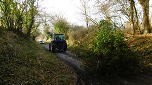 A tractor removing the tree.
