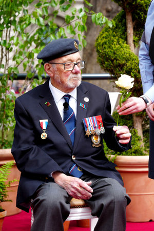 Mr Kennett received a peace rose near Parliament Square, central London, ahead of a military procession marking the 80th anniversary of VE Day, Credit: Jeff Moore/PA Wire
