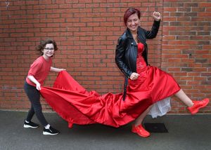 Debbie O'Kelly, from Lawley, Telford, who is going to run the London Marathon in her wedding dress to raise money for charity after her daughter Dulcie (holding the train) was given the all clear from cancer last year.