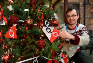 Christmas tree festival at Red House Glass Cone, Wordsley. Customer services assistant Mark Jeffs with the Red House Glass Cone tree.