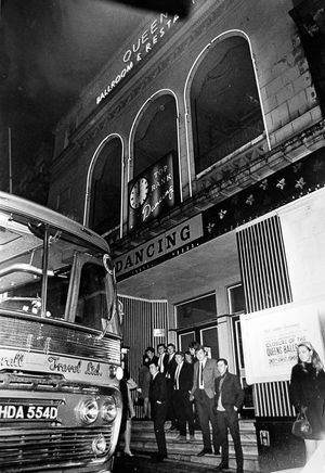The Queen's ballroom, Wolverhampton, when it closed, the original caption reads: 'Wolverhampton's only full time ballroom, the Queen's, closed on New Year's Eve and now the town's teenagers must travel elsewhere if they want to go dancing.' The poster on the right seems to read: 'Top Rank Dancing. Owing to unforeseen difficulties we regret to announce the closure of the Queens Ballroom effective from 30th Dec, 1968.' 