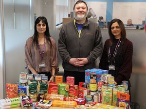 Supporting image for story: College staff donate food packages to families in need