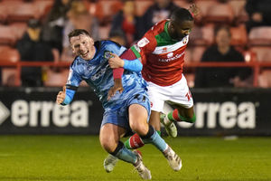 Forest Green Rovers' Regan Hendry (left) and Walsall's Emmanuel Osadebe 