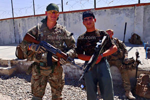 Corporal Brent McCarthy from Telford is pictured with one of the Afghan Uniformed Police officers just moments before the shooting in this picture given to the Shropshire Star by his family
