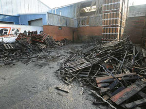 Supporting image for story: Wooden pallets go up in flames