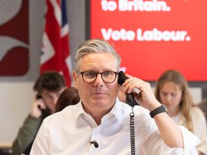 Sir Keir Starmer on the phone during a Labour Party telephone campaigning session
