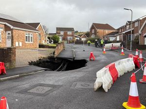 Supporting image for story: Residents told to avoid area after large sinkhole appears on housing estate