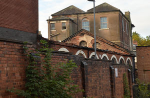 The missing roof of the working men's club is noticeable