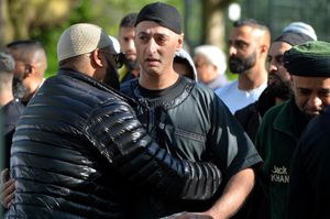 Ali’s father Toheed Tazeem is embraced by a well-wisher at the gathering