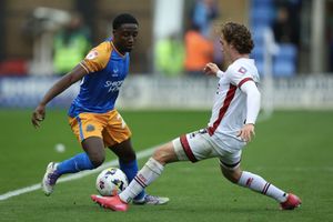 Ismeal Kabia of Shrewsbury Town and Harry Forster of Crawley Town