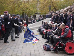 Military veterans observe a minute's silence during a Remembrance Sunday service in Guildhall Square, Portsmouth