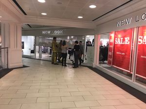 Firefighters and New Look staff outside the shop 