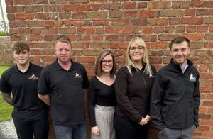 ALS Projects founder Alex Swancott (right) with the team