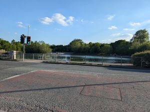 Police are investigating following the death of a woman who was found in a body of water in Bilston