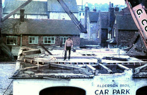 Another picture of the dismantling of the old Cockpit Theatre which was behind the Crown Hotel in Bridgnorth, 1973. The picture shows that the roof has been taken off - the roof of the building was saved and later re-erected at Avoncroft (on a new brick base), but the rest of the Cockpit was demolished. It was originally a cockpit, and later a theatre for a time. Picture: Avoncroft Museum of Historic Buildings.