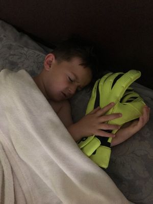 Patrick sleeping with the gloves