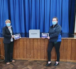 Head teacher at Shrewsbury Academy Julie Johnson (left) receives tablets from Pave Aways’ commercial director Victoria Lawson