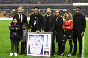 Gibbs-White with his family, academy boss Gareth Prosser and Wolves legend Steve Bull at half time during last Friday's Fulham game (AMA SPORTS PHOTO AGENCY)