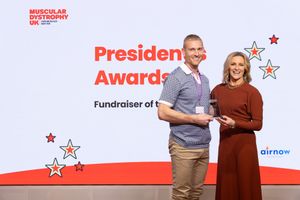 Tom Penzer Adams receiving his ‘Fundraiser of the Year’ award from Gabby Logan MBE, President of Muscular Dystrophy UK