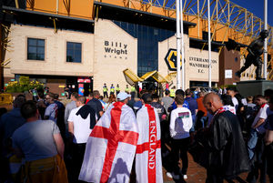 England fans arrive ahead of the UEFA Nations League match at the Molineux Stadium, Wolverhampton. Picture date: Tuesday June 14, 2022.